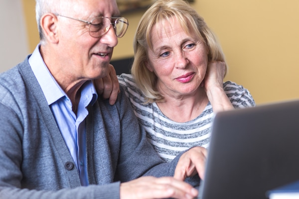 Older couple researching how a heat pump works. Superior Heating Cooling Plumbing blog image.